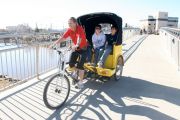 pedicab ride crossing bridge